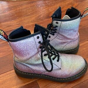 Purple sparkly high top Dr. Martens boots with side zipper.